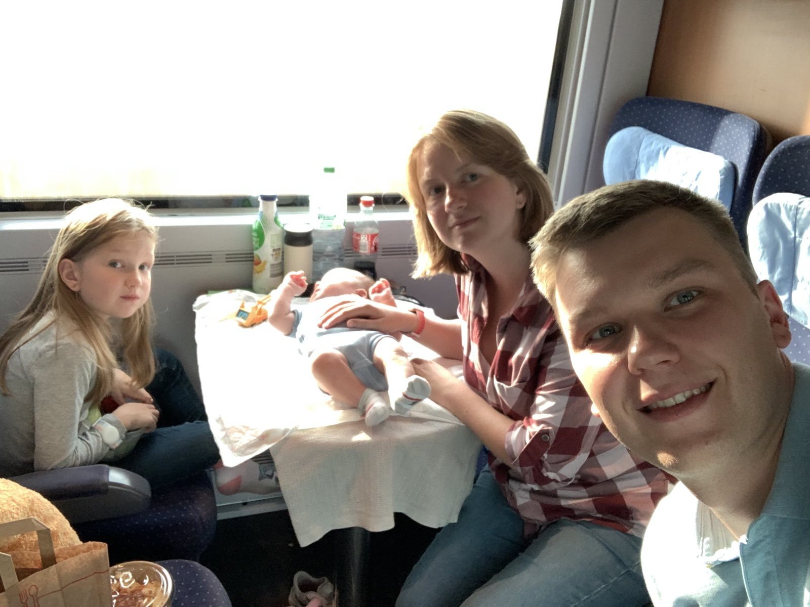Our designer Alex on the train with his family